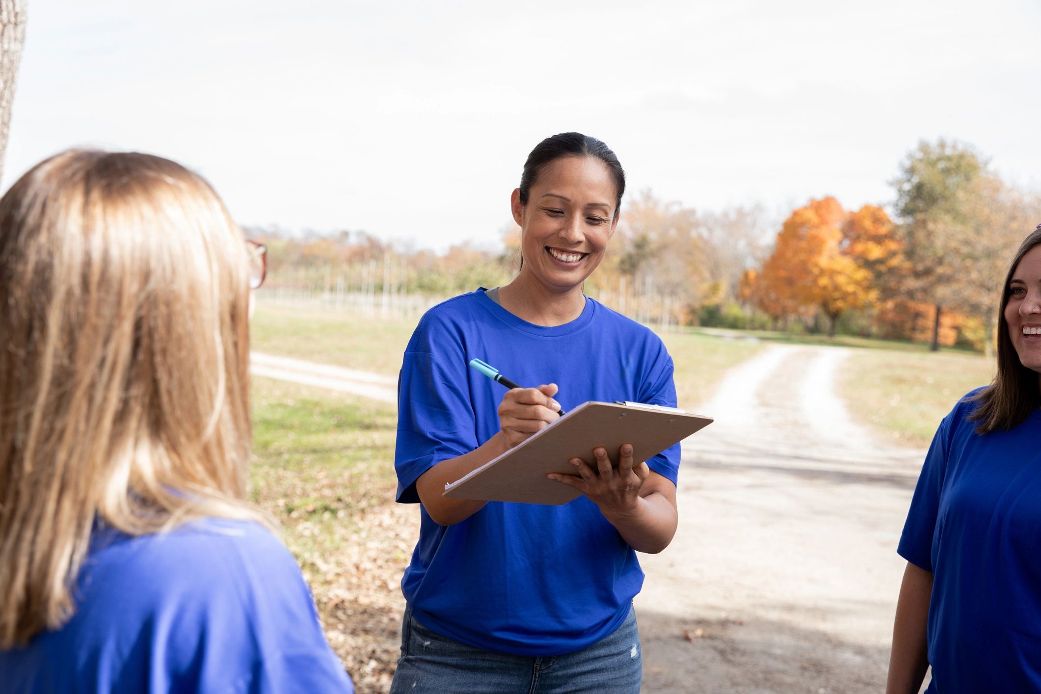 Volunteers coordinating event sign-ups