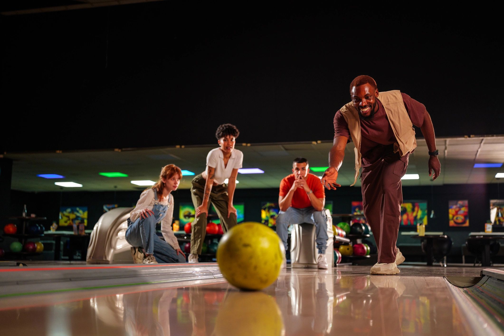 Friends enjoying a bowling night together